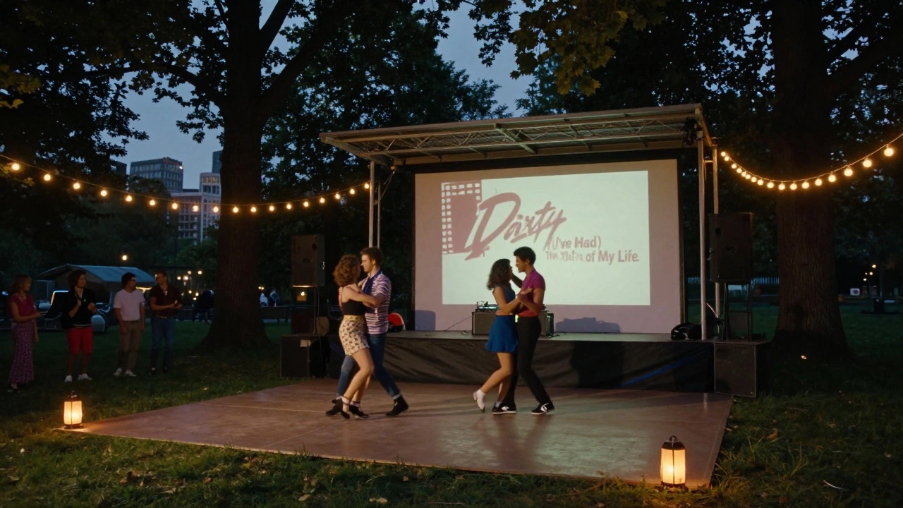 Dancers in 1980s outfits dance under trees in Vondelpark with a water tank stage and Dirty Dancing projections.